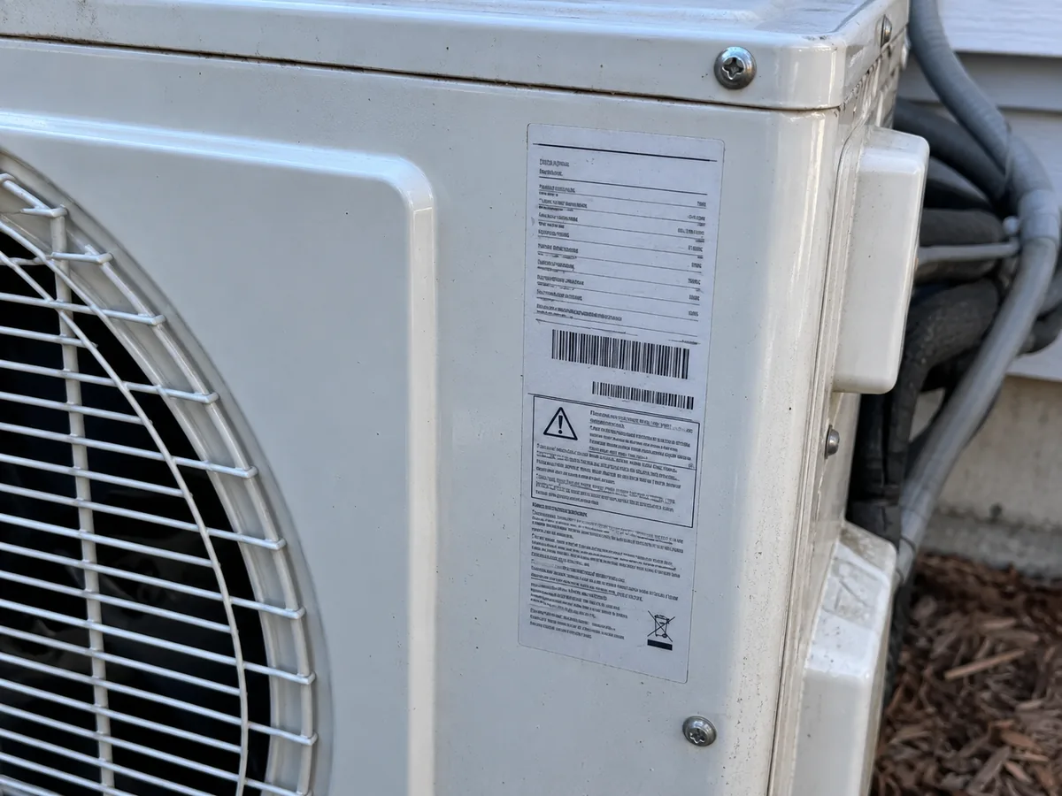 AI illustration of an outdoor unit identification-label location; label is not real equipment data