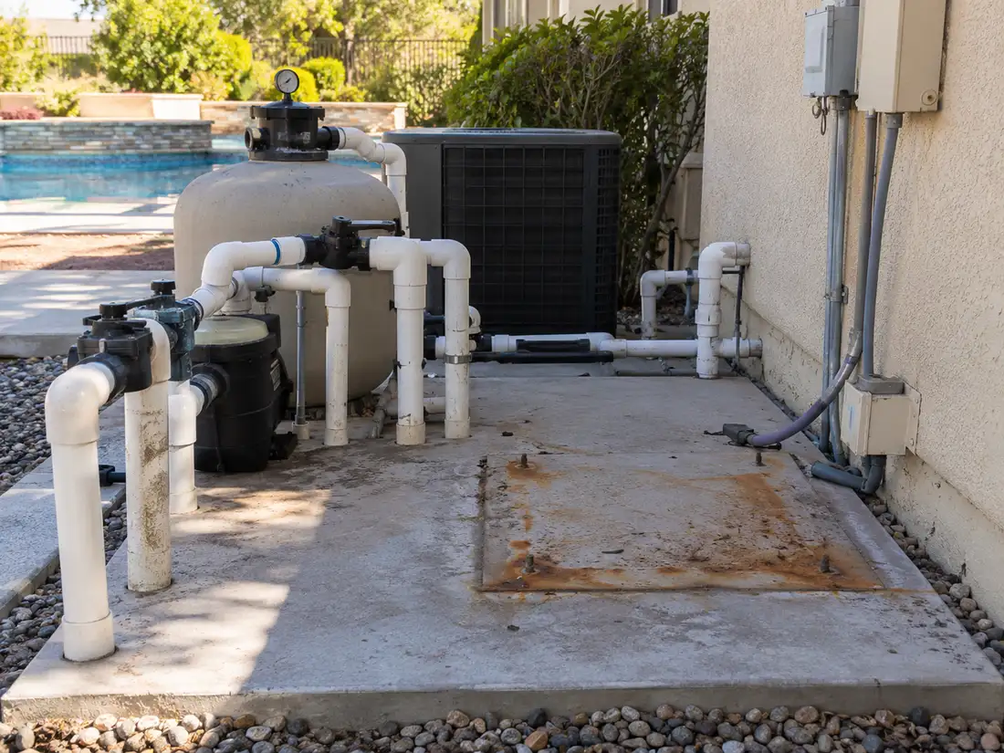 Existing pool equipment and open equipment pad prepared for replacement