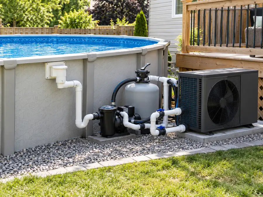 Above-ground swimming pool with nearby heat pump, filter and circulation pump